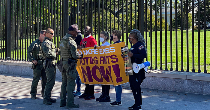 The final group of five out of 25 activists speak to police immediately before their arrest in front of the White House while protesting for voting rights on October 19, 2021.