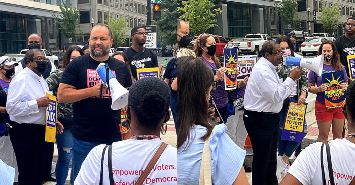 People For President Ben Jealous and People For Board Member Rev. Timothy McDonald rally the crowd at Black Lives Matter Plaza before marching to the White House on October 5, 2021.