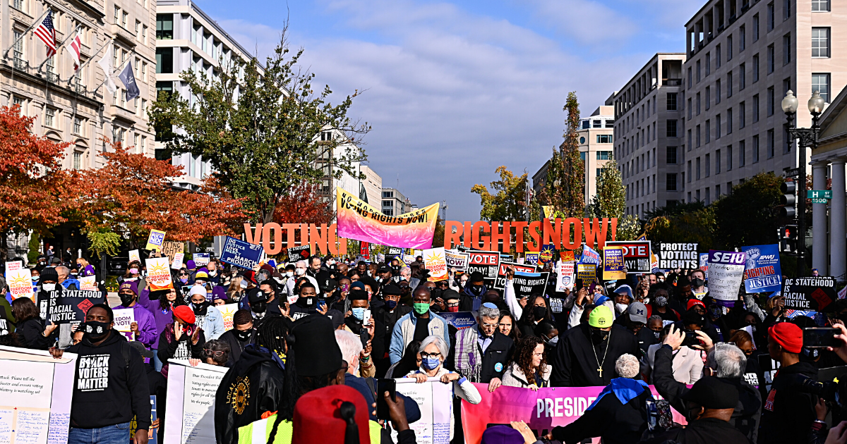 A crowd of around 800 people march to the White House down Black Lives Matter Plaza on November 17, 2021.