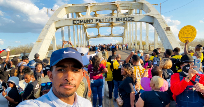 Markus Batchelor, People For's Deputy Director of Youth Engagement, joins the marchers at Edmund Pettus Bridge in Selma, Alabama.