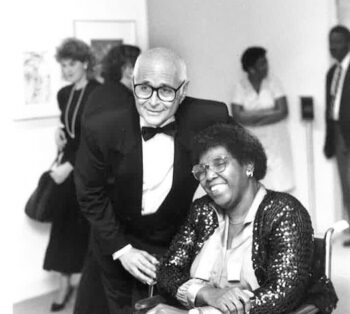 Norman Lear stands next to Barbara Jordan.